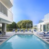 swimming pool with chairs surrounding it