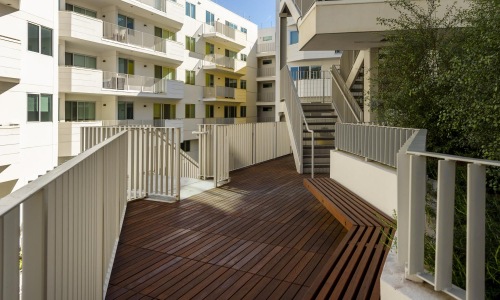 a wooden walkway between buildings