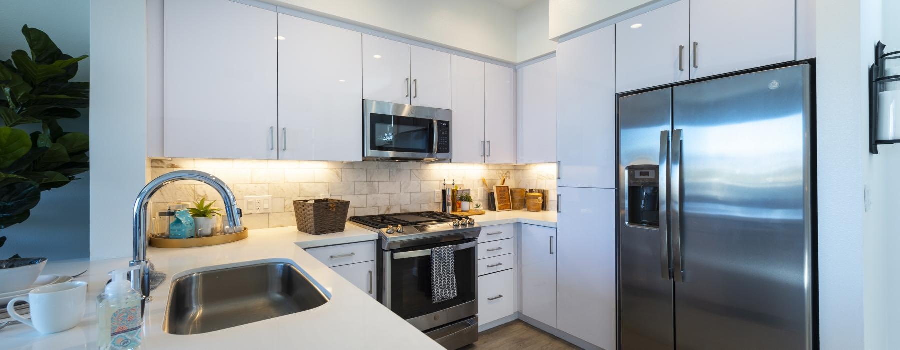 a kitchen with white cabinets