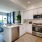 a kitchen with white cabinets