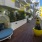 a deck with a chair and potted plants on it