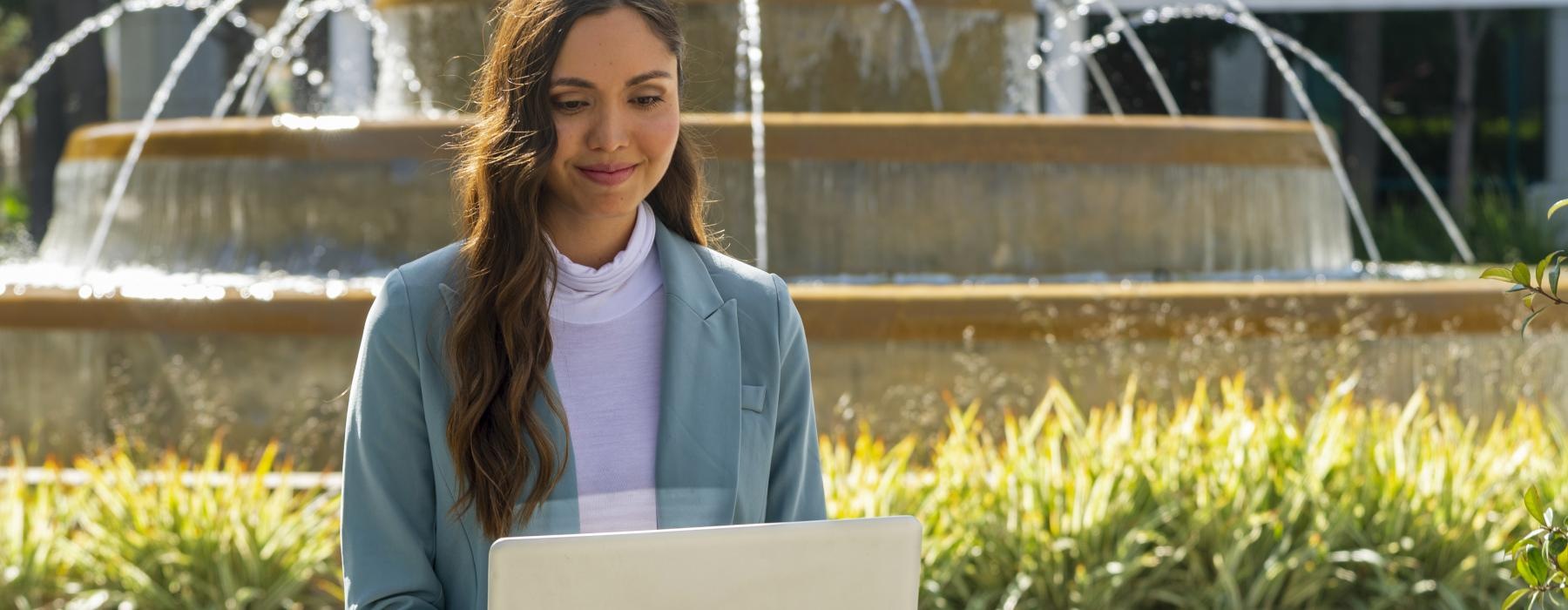 a woman holding a laptop