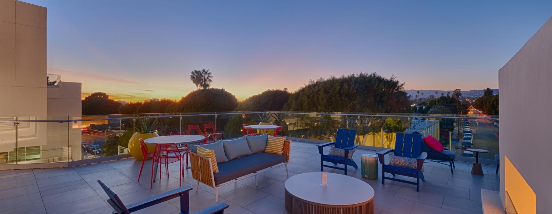 a patio with tables and chairs