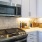 a kitchen with white cabinets