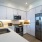 a kitchen with white cabinets